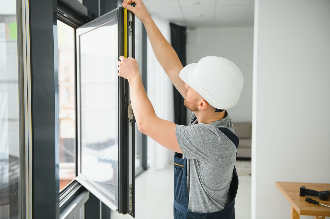 a worker installing a window